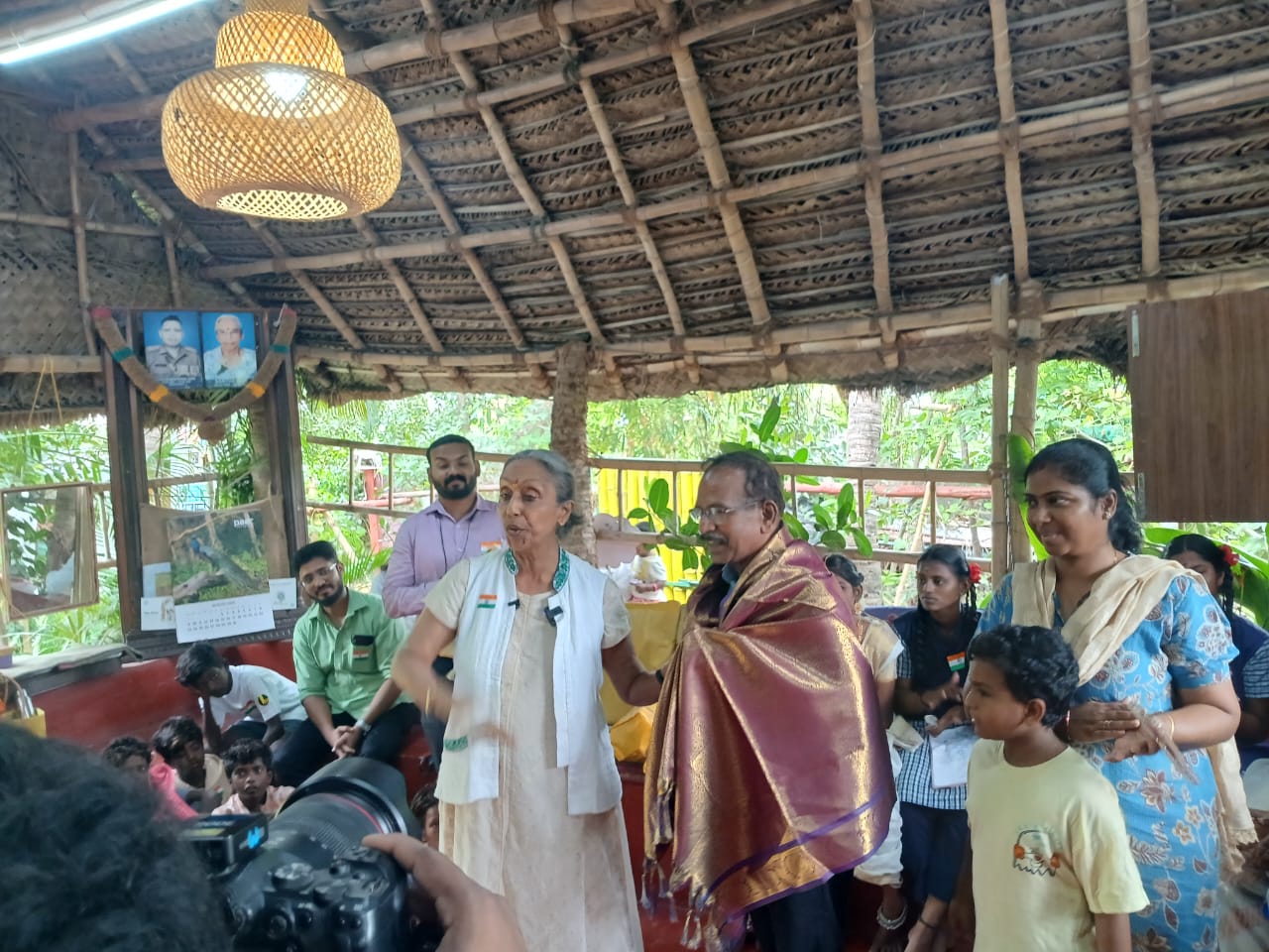A senior guest is honoured with a ponnadai at EPIC SS Padur during the Independence Day programme