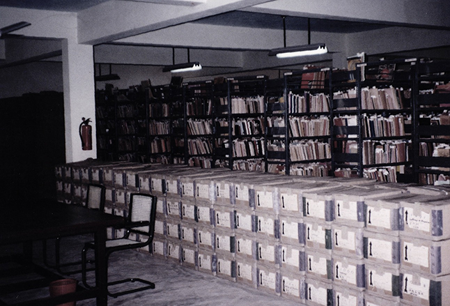 Books, periodicals and archival boxes inside RMRL